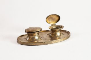 WEIGHTED PLAIN SILVER PRESENTATION DOUBLE INKWELL, of oval form with moulded base and clear glass