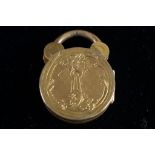 VICTORIAN WELL ENGRAVED CIRCULAR PADLOCK PATTERN LOCKET with gold back and front, 3/4" diameter (