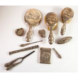 ELEVEN PICES OF SILVER EMBOSSED WITH REYNOLD’S ANGELS, comprising: DRESSING TABLE HAND MIRROR,