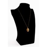 9ct GOLD FINE CHAIN NECKLACE and 9ct GOLD OVAL LOCKET PENDANT with foliate scroll engraved front,