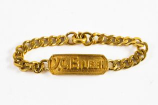 CHINESE GOLD IDENTITY BRACELET with flattened curb pattern links, the panel embossed Y.C. EILEEN, (