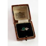 UNMARKED WHITE GOLD OR PLATINUM CROSSOVER RING CLAW SET WITH A DIAMOND AND CABOCHON EMERALD, 2.5 gms