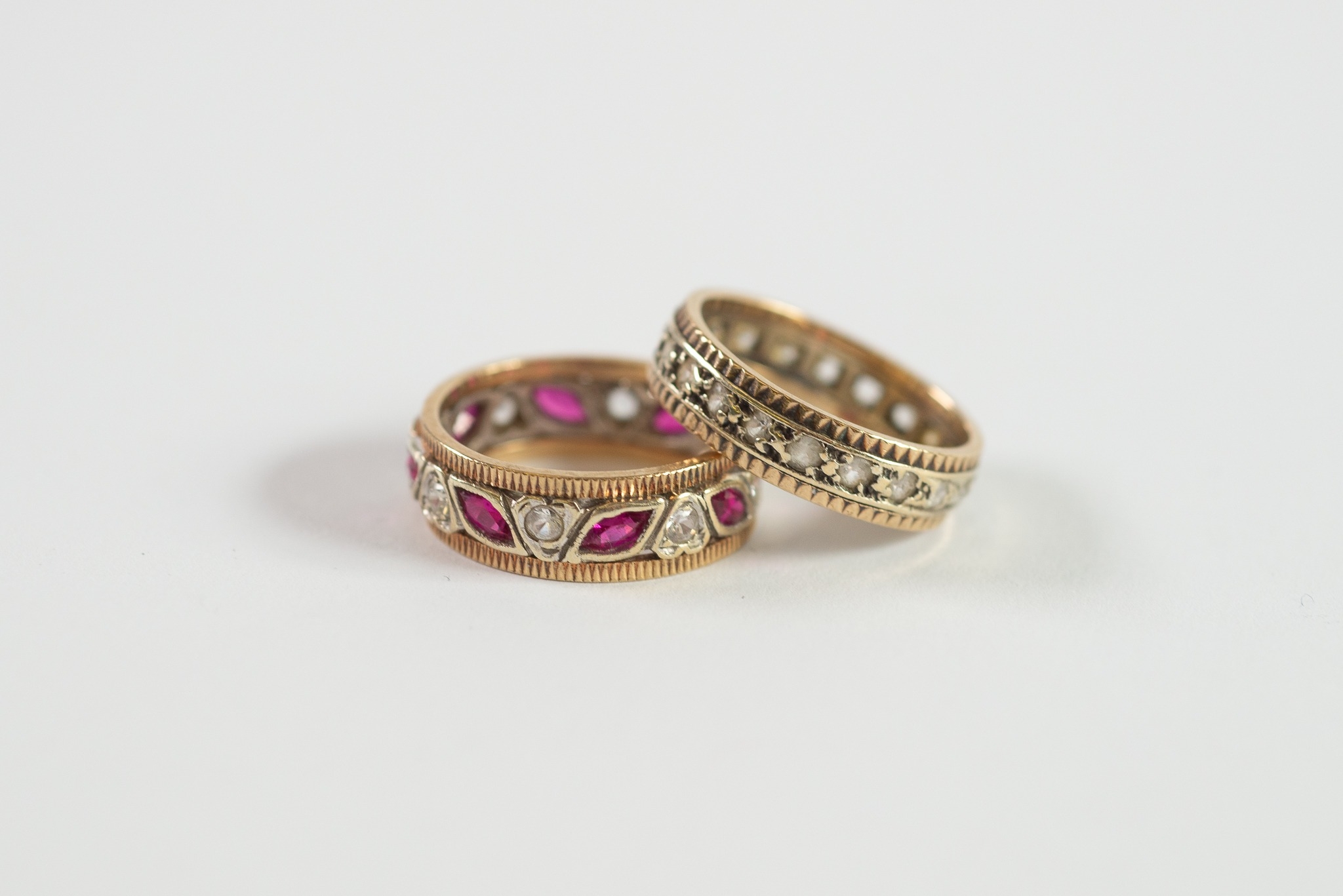 9ct GOLD ETERNITY RING set with rubies and tiny white stones; and 9ct GOLD ETERNITY RING set with