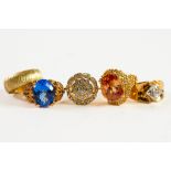 GOLD-PLATED SILVER RINGS, 2 of similar style with ornate shoulders, one claw set with a blue