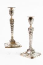 PAIR OF VICTORIAN EMBOSSED AND WEIGHTED SILVER CANDLESTICKS, each of square, tapering form with