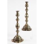 GEORGE VI PAIR OF ENGRAVED SILVER TABLE CANDLESTICKS, each of slender baluster form with