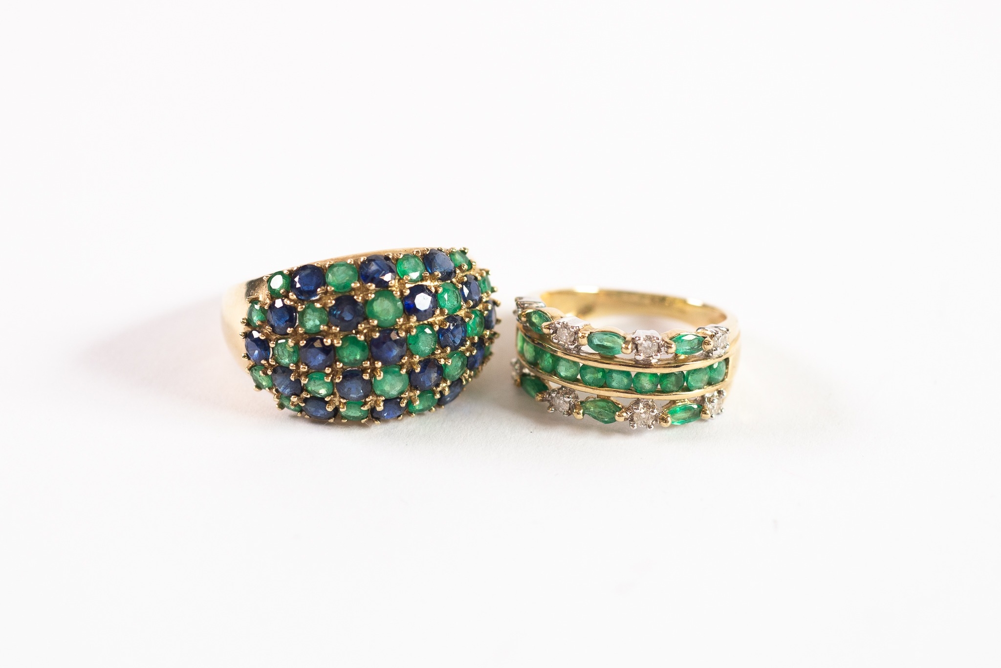 9ct GOLD QVC TRIPLE STRAND HALF HOOP RING, set with numerous small emeralds and eight small diamonds