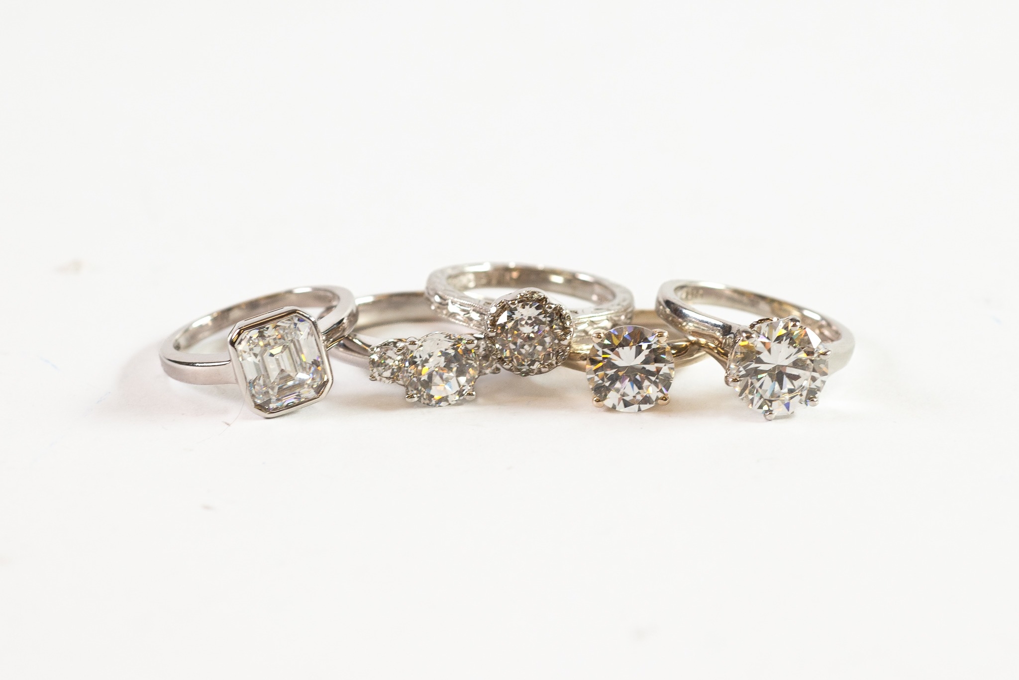 5 SILVER AND CZ SOLITAIRE-STYLE RINGS (5)