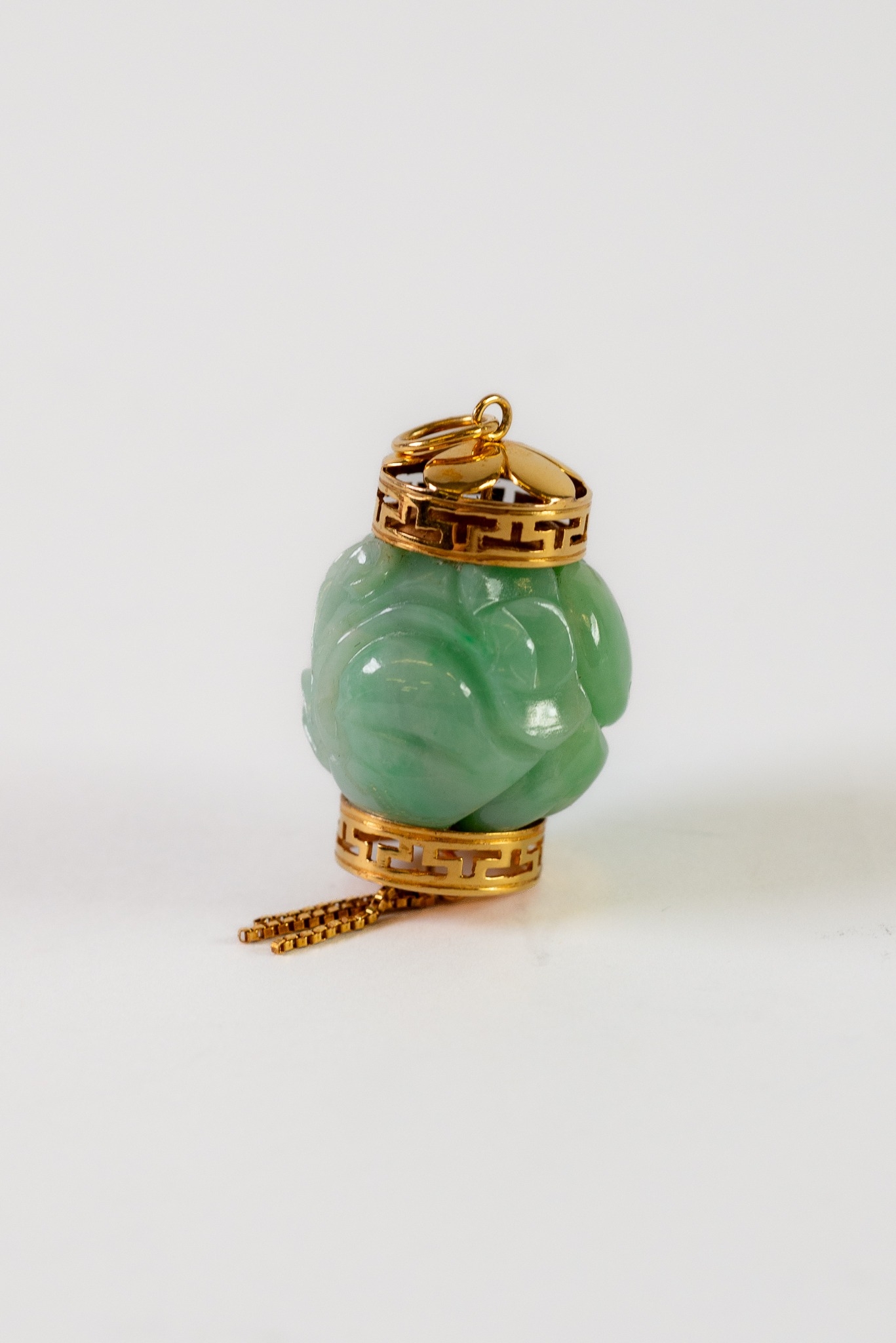 CHINESE CARVED GREEN JADE AND GOLD COLOUR METAL MOUNTED LANTERN FORM NOVELTY PENDANT