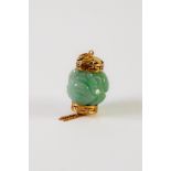 CHINESE CARVED GREEN JADE AND GOLD COLOUR METAL MOUNTED LANTERN FORM NOVELTY PENDANT