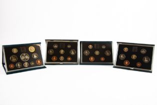 FOUR ROYAL MINT UNITED KINGDOM PROOF COIN SETS, for years 1985, (lacks certificate), 1990 and