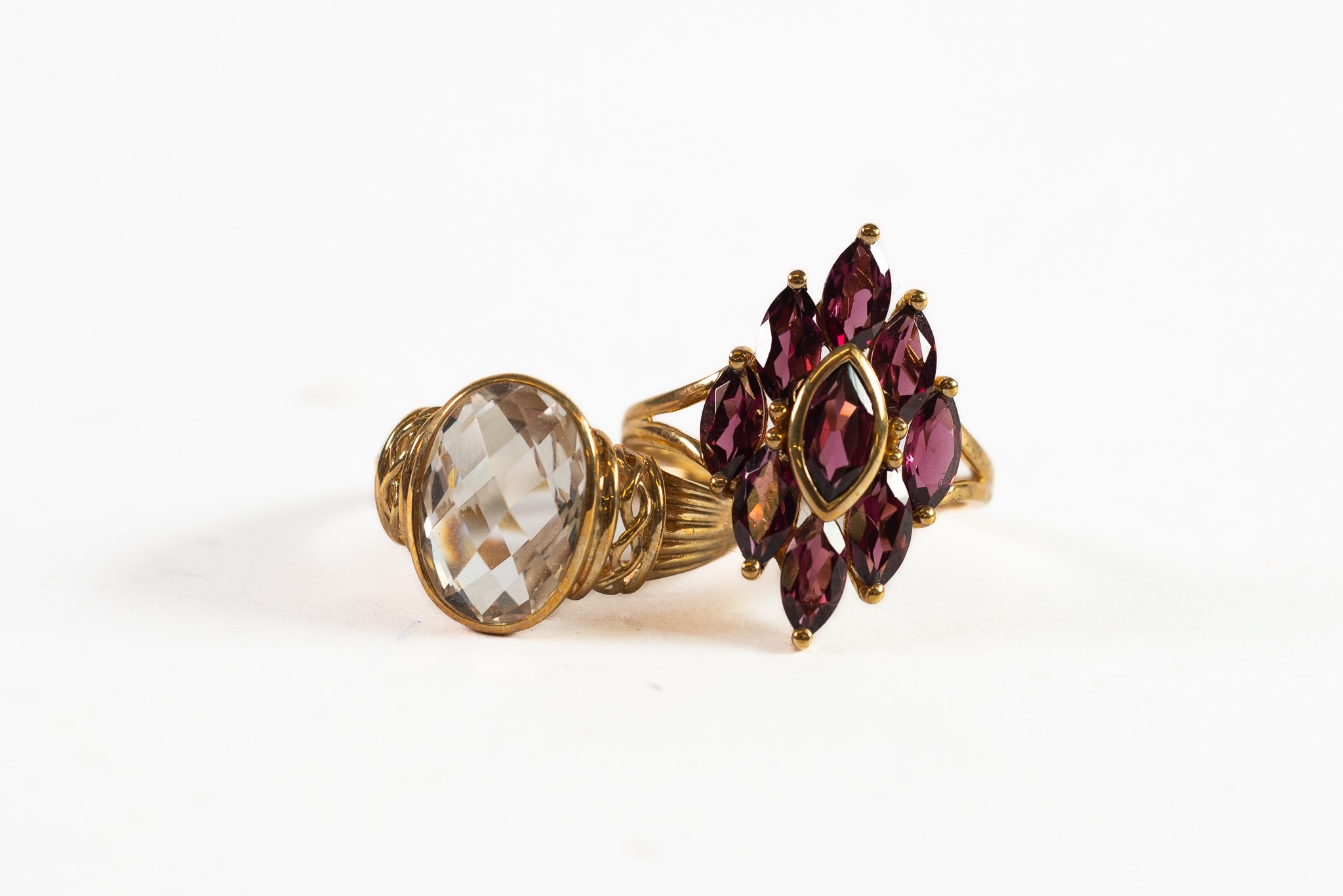 9ct GOLD RING with large oval rock crystal, chequerboard cut with carved shoulders; 9ct GOLD