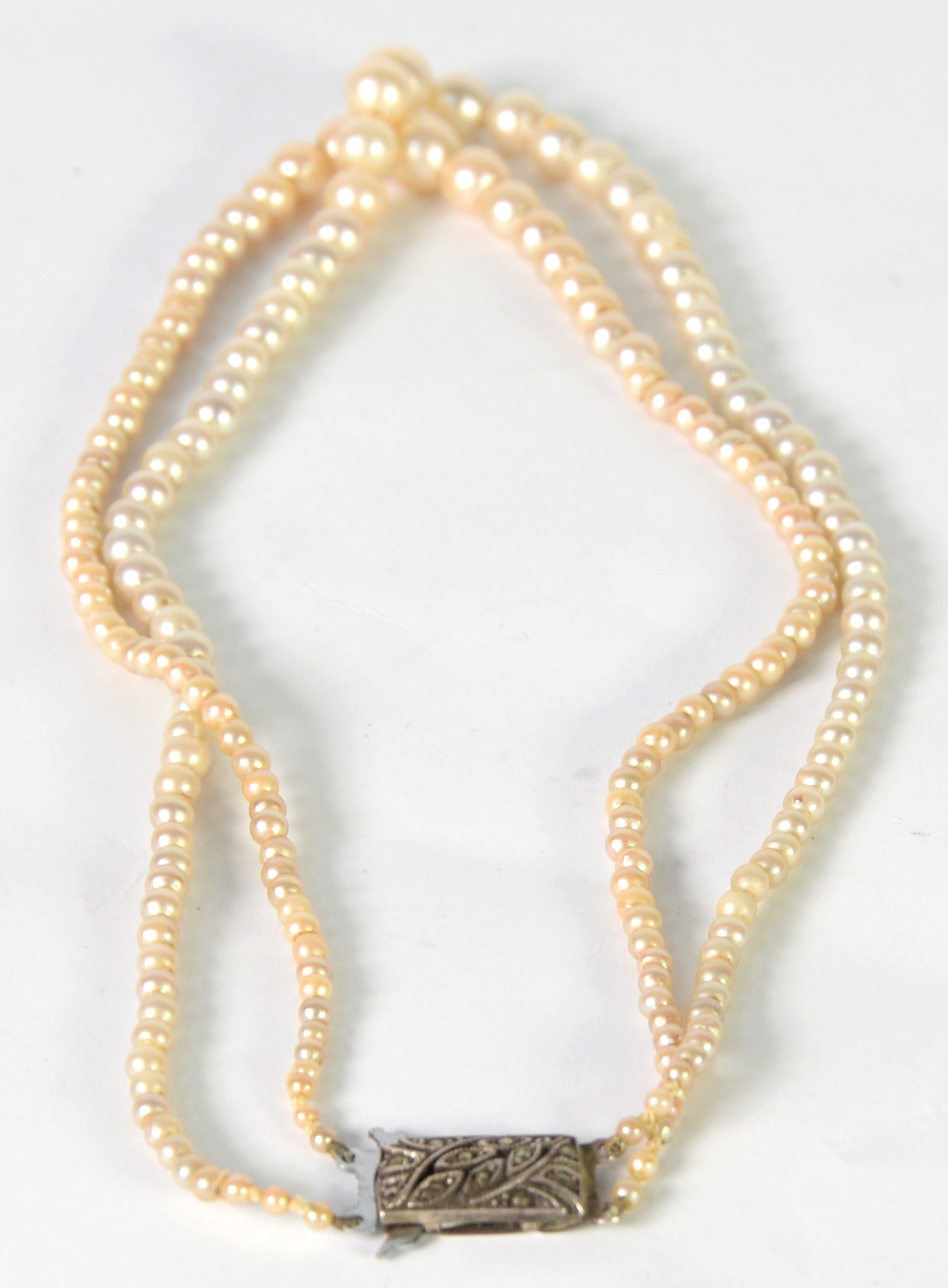 TWO-STRAND NECKLACE OF GRADUATED CULTURED PEARLS with silver and marcasite clasp, 16in (40.5cm) long