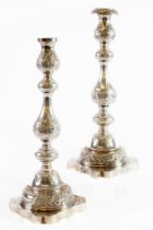 GEORGE V PAIR OF ENGRAVED PESENTATION SILVER TABLE CANDLESTICKS, each of baluster form with
