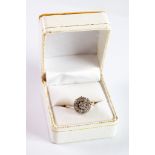 DIAMOND DAISY CLUSTER RING with raised centre diamond, approximately 0.50ct, with surround of