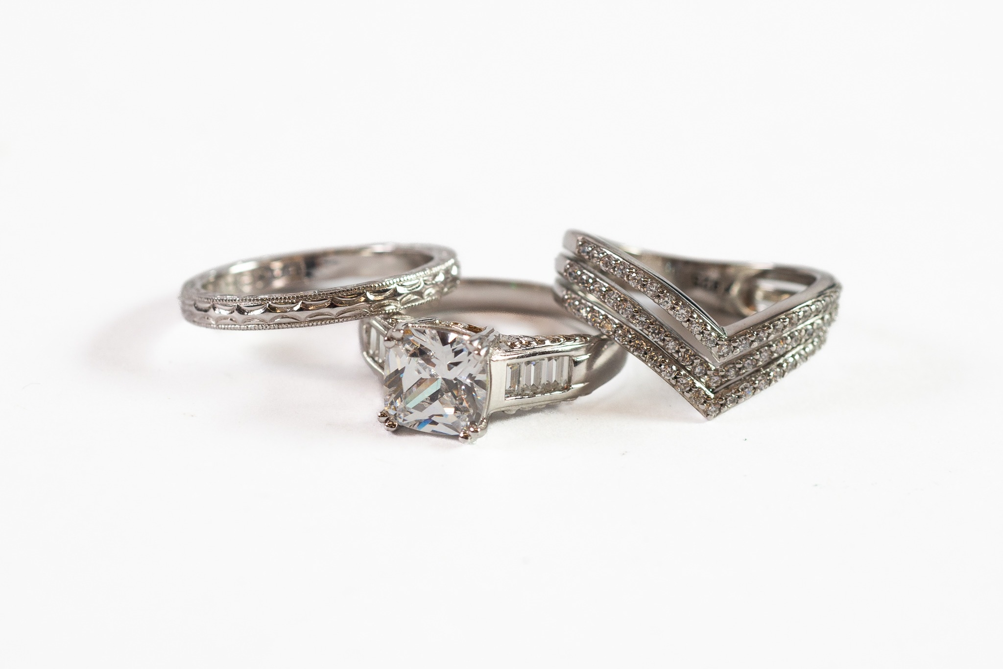 SILVER RING, set with a princess cut CZ stone and baguette stones to the shoulders and TWO OTHER