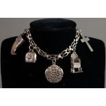 SILVER CHARM BRACELET WITH PIERCED PANEL LINKS, padlock clasp and five silver charms, Victorian