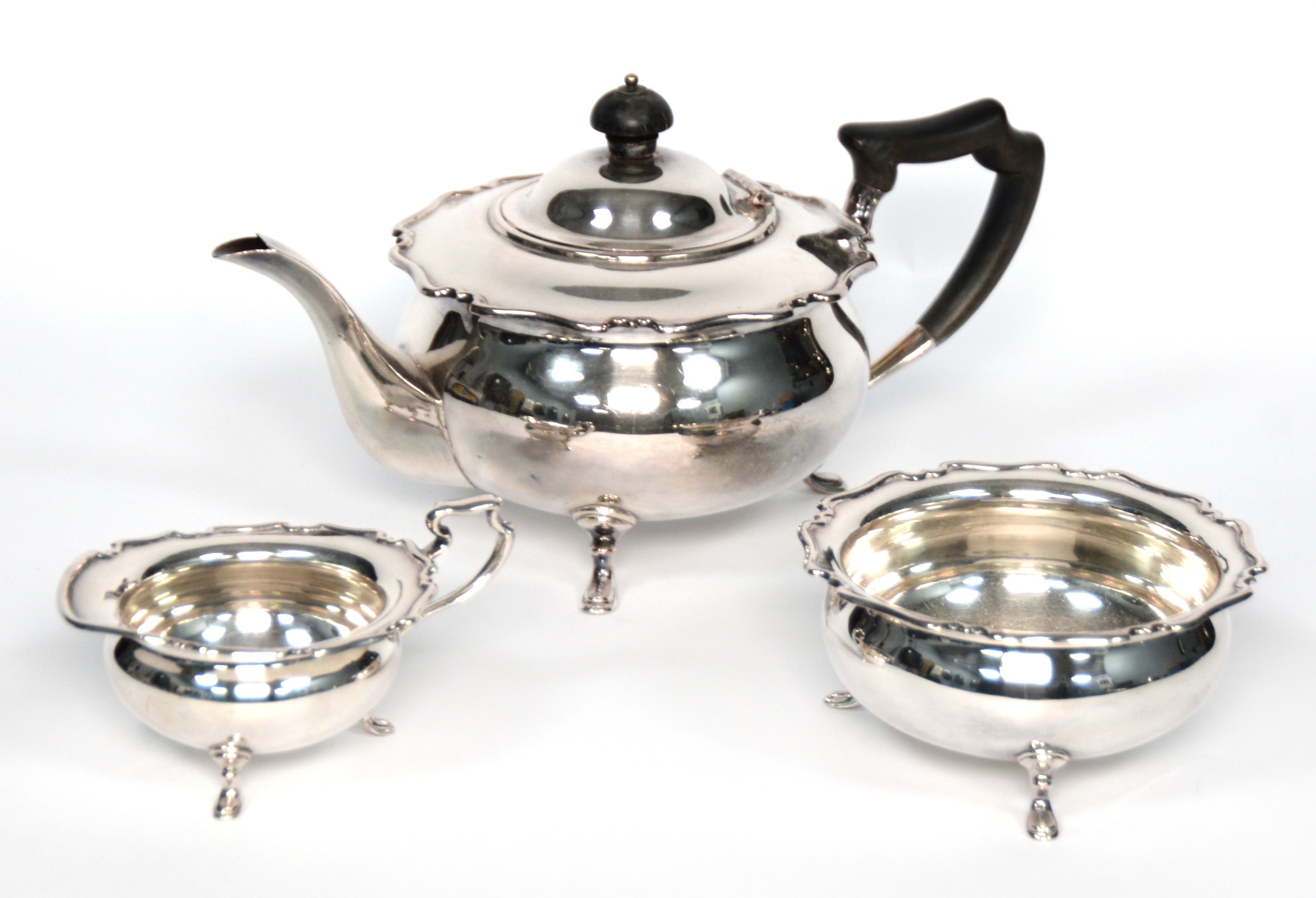 ELECTROPLATED TEA SERVICE OF THREE PIECES, circular and bulbous with shaped edge to the shoulder,