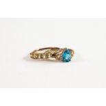 9ct GOLD RING set with tear shaped blue topaz with two tiny diamonds to each shoulder; and 9ct