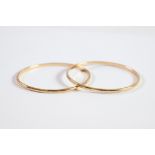 PAIR OF GOLD COLOURED METAL BANGLES, 3in (7.6cm) diameter, 34.8gms, (marked 9ct and tests 9.9ct)