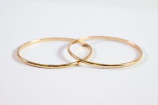 PAIR OF GOLD COLOURED METAL BANGLES, 3in (7.6cm) diameter, 34.8gms, (marked 9ct and tests 9.9ct)