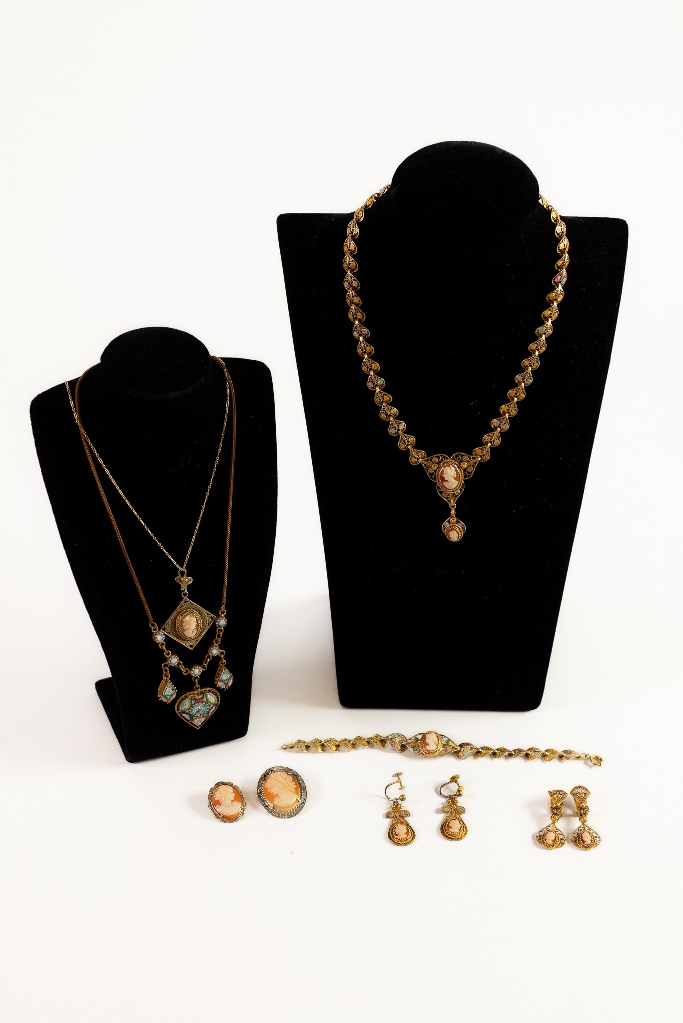 COMPOSITE SUITE OF VINTAGE GILT METAL, FILIGREE WORK AND CAMEO SET COSTUME JEWELLERY comprising;