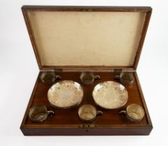 CASED SET OF SIX ANGLO INDIAN EMBOSSED SILVER COLOURED METAL TEA CUPS AND SAUCERS, profusely