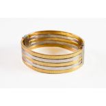 14k GOLD BROAD HINGE-OPENING BANGLE with three yellow gold Greek key chased bands alternating with