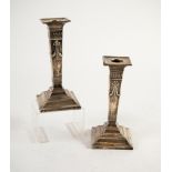 GEORGE V PAIR OF EMBOSSED AND WEIGHTED PRESENTATION SILVER DRESSING TABLE CANDLESTICKS, each of