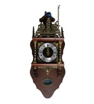 REPRODUCTION DUTCH STYLE MAHOGANY SYTAINED AND BRASS WALL CLOCK, with 5” Roman dial, figural