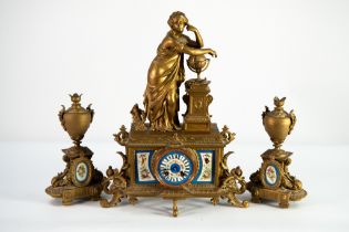 EARLY TWENTIETH CENTURY FRENCH THREE PIECE GILT METAL CLOCK GARNITURE WITH SEVRES STYLE HAND PAINTED