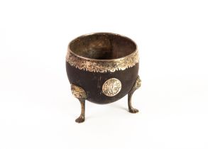 18TH CENTURY COCONUT CUP with shaped silver coloured metal outer rim, monogrammed oval plaque and