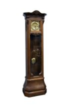 MODERN CARVED OAK LONGCASE CLOCK, the 10 ½” Arabic brass dial with embossed spandrels, powered by