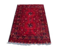 GOOD QUALITY TURKOMAN BALOUCHI RUG, wine red with two circular floral medallions and a delicate