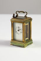 EARLY TWENTIETH CENTURY BRASS CASED SMALL CARRIAGE CLOCK, of typical form with oblong top glass,