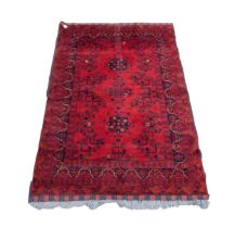 GOOD QUALITY TURKOMAN BALOUCHI RUG, wine red with black design, having two floral medallions and