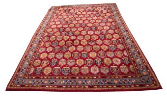 BRITISH WOVEN AXMINSTER CARPET OF PERSIAN DESIGN, with fifteen rows of eleven small multi-coloured