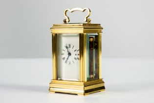 TWENTIETH CENTURY BRASS CASED SMALL CARRIAGE CLOCK, of typical form with bevel edged oblong glass to
