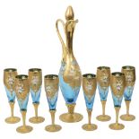 A Murano glass Tre Fuochi style decanter and eight champagne flutes
