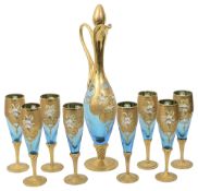 A Murano glass Tre Fuochi style decanter and eight champagne flutes