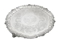 A large George III silver salver with later added rim and feet