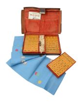 An early 20th century leather cased set of Mah-Jong c.1930