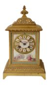 A late 19th century French ormolu and Sevres style porcelain mantle clock