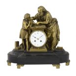 A late 19th century French Ormolu and black marble mantle clock