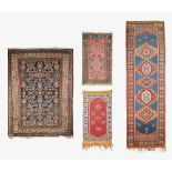 Four early 20th century Persian rugs