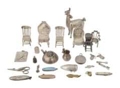 A small collection of silver miniature furniture