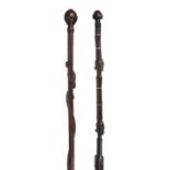 Two African carved hardwood tribal walking canes