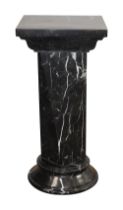 An Edwardian mottled black marble plinth