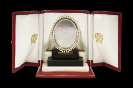 Cartier. A silver gold and cultured pearl picture frame c.1950