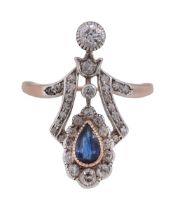 An Edwardian ornate sapphire and diamond-set ring